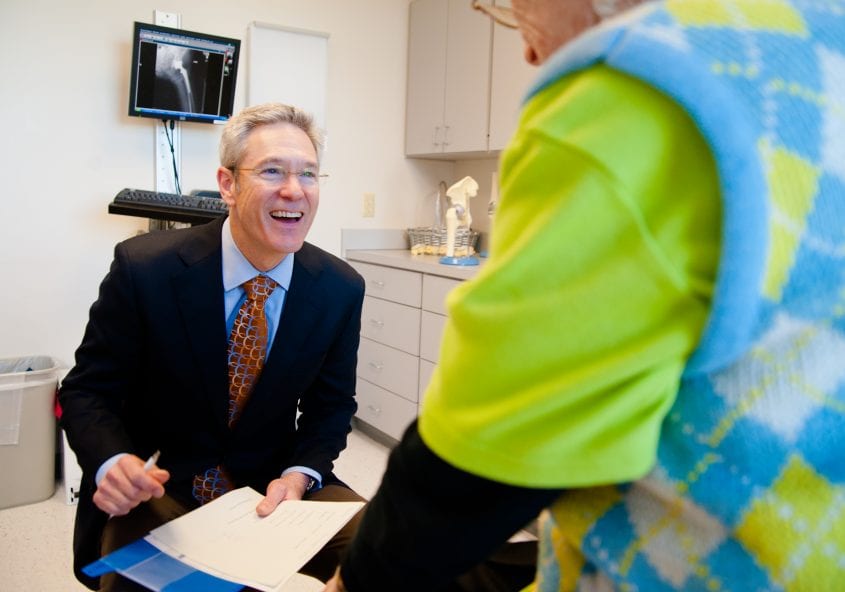 Dr. Grimsley interacting with a patient OrthoEdge Orthopedic Specialists Jacksonville Florida ortho edge fl