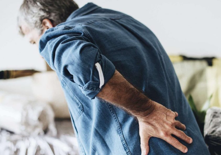 man seeking relief from lumbar strain